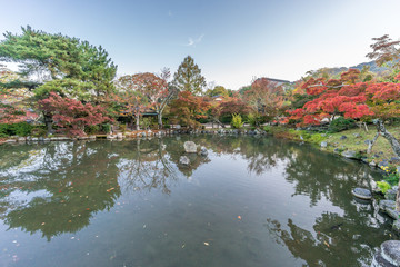 Momiji (Maple tree) Autumn colors, Fall foliage pond reflections at Maruyama park (Maruyama-Kouen) Located near Yasaka shrine, Kyoto, Japan