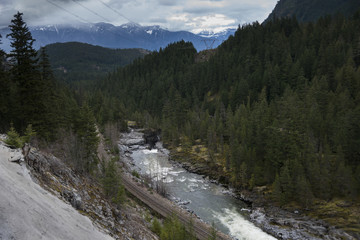 Fototapeta na wymiar River flowing through valley, Pemberton, Whistler, British Columbia, Canada