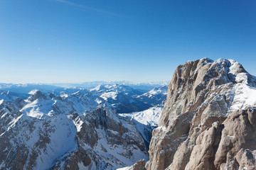 Sunny view. Ski resort and ski slopes in the winter season, Italy. The Dolomites Alps