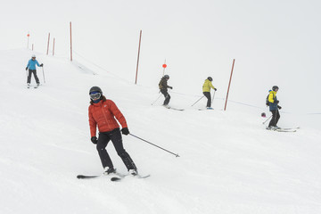 Tourists skiing on snowy mountain, Whistler, British Columbia, Canada