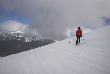Fototapeta na wymiar Tourist skiing on snowy mountain, Whistler, British Columbia, Canada