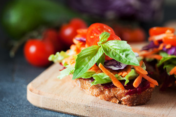 Healthy sandwich made of a fresh ciabbata with fresh vegan ingredients
