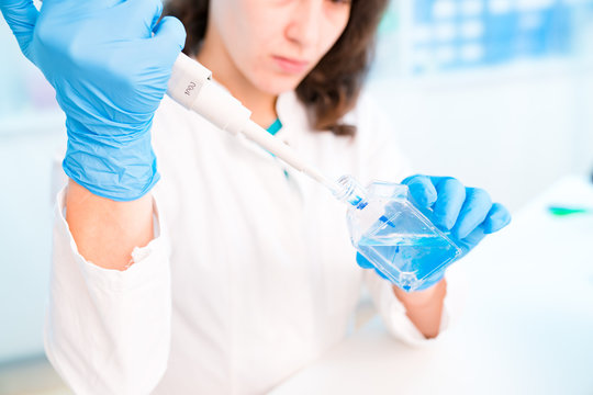 Young woman in microbiological laboratory