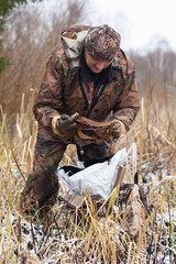 hunter with leghold trap
