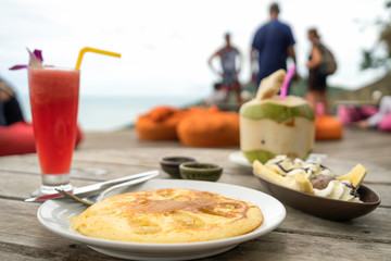 Crepes stuffed savory Banana with chocolate and delicious fragrance. Watermelon with ice cream refreshing in summer on wood table