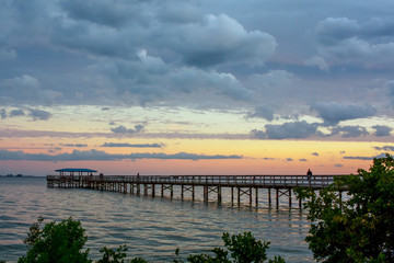 A silhouette of the  Safety Harbor pier on Tampa Bay in Florida during a purple sunset.
