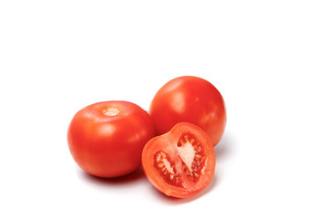 Tomato and a slice of a tomato on a white background, isolate