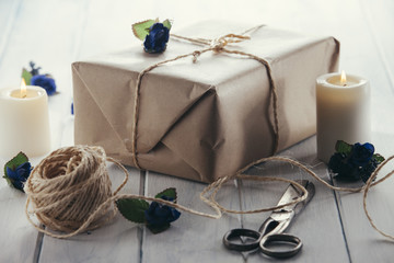 Packs wrapped in kraft paper and candles.