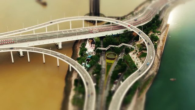 Minature Highway Stack Interchange (tilt-shift) Exrtreme wide shot of Avenida Panoramica do Lago Sai Van