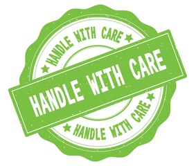 HANDLE WITH CARE text, written on green round badge.