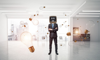 Businessman with an old TV instead of head.