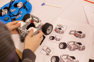 Child making robot car machine. Hobby concept