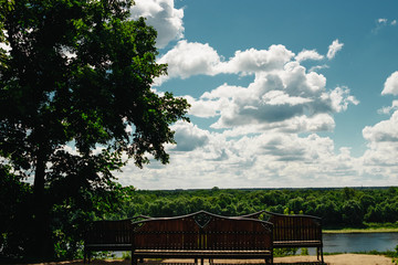 On the shore of lake - comfortable wooden benches. Early morning on cold Pyramid Lake, Jasper National Park