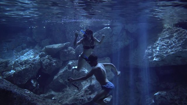 Couple In Swimsuit Make A Himself Photo Underwater In Cenote Cave Dos Ojos