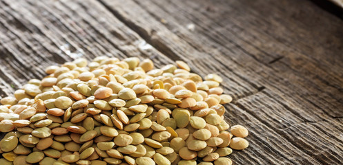Lentils on an old wooden table