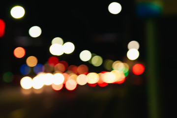 Blurred Christmas lights on a black background, bokeh. Light bokeh abstract. The concept of the new year 2018, holidays, vacation.