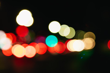 Blurred Christmas lights on a black background, bokeh. Light bokeh abstract. The concept of the new year 2018, holidays, vacation.