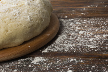 dough with close-up. man is preparing bread dough