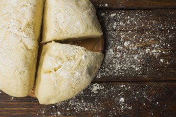 dough with close-up. man is preparing bread dough