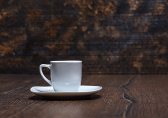Coffee cup with saucer on a wooden table