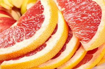 Segments of grapefruit close-up. Pieces of sweet, bitter, sour exotic citrus fruit. The best fruit for a diet for slimming people. Dietary dessert from a nutritionist.