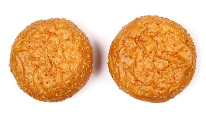 Burger buns with sesame isolated on white background, top view