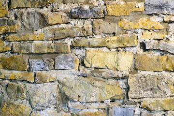 dilapidated brick wall with collapsed plaster