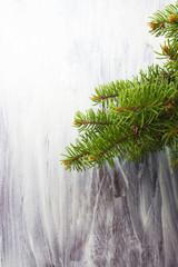Twig Christmas tree on wooden background