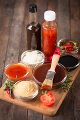 Barbeque sauce with ingredients on the table