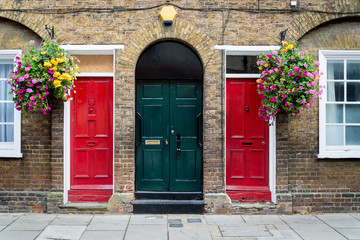 Typical British doors  with doorbell in London. Two colorfull doors, London, England, UK