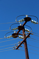 power line with electrical pole in the clear sky