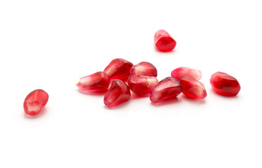 Pomegranate grains isolated on white background.