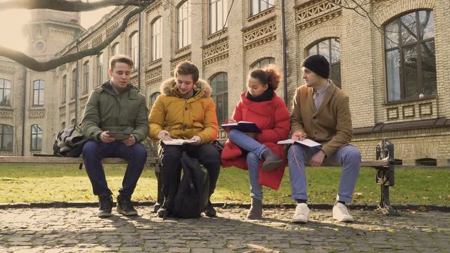 Four friends dicussing future exams at university
