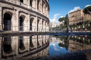 Obraz premium The Colosseum and the reflection of a puddle, Rome, Italy