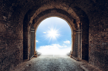 Old tunnel with light on the end of road