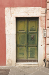 Fototapeta na wymiar Wooden door with marble decorations