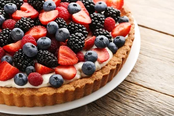 Zelfklevend Fotobehang Sweet tart with berries in plate on grey wooden table © 5second