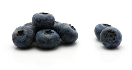 Bog blueberries isolated on white background fresh heap.