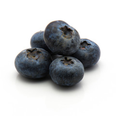 Bog blueberries isolated on white background heap of whole.