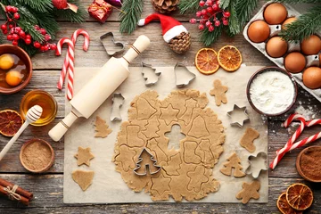 Tuinposter Baking christmas cookies on grey wooden table © 5second