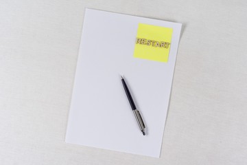 Clean paper, sticker with the word restart. Business concept
