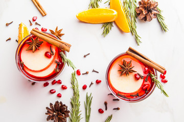 Christmas. Winter cocktail grog, hot sangria, mulled wine. On white marble table.
