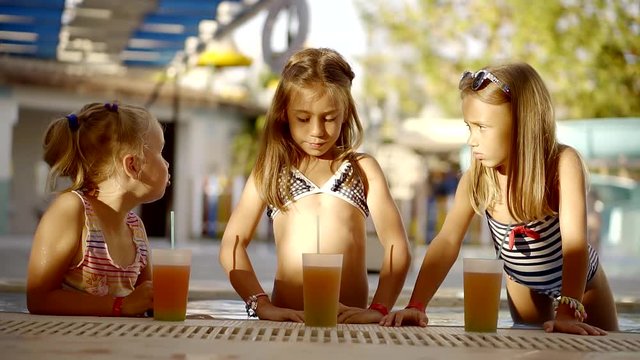 Three girls are having fun in the pool