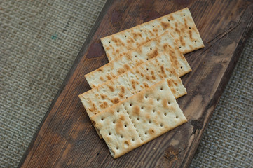 several cookies cracker on a simple wooden background