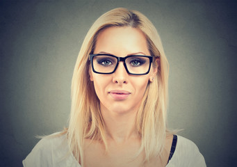 Portrait of a serious young woman wearing glasses 