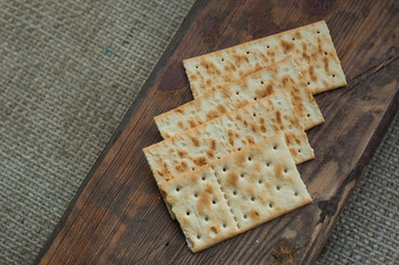 several cookies cracker on a simple wooden background