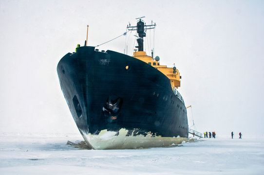 Giant Black Ice Breaker Ship,in The Ice Cold Water Of The North Ocean