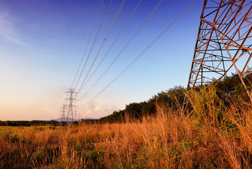 High voltage post or High voltage tower at sunset