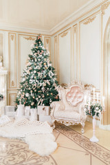 Christmas evening. classic apartments with a white fireplace.
