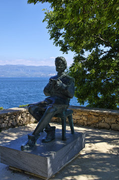 Vrbnik, Croatia - April, 30, 2017: Statue of Blaz Baromic, One of the first printer, calligraphers who founded senj using the glagolitic alphabet in print. Vrbnik, Krk, Croatia